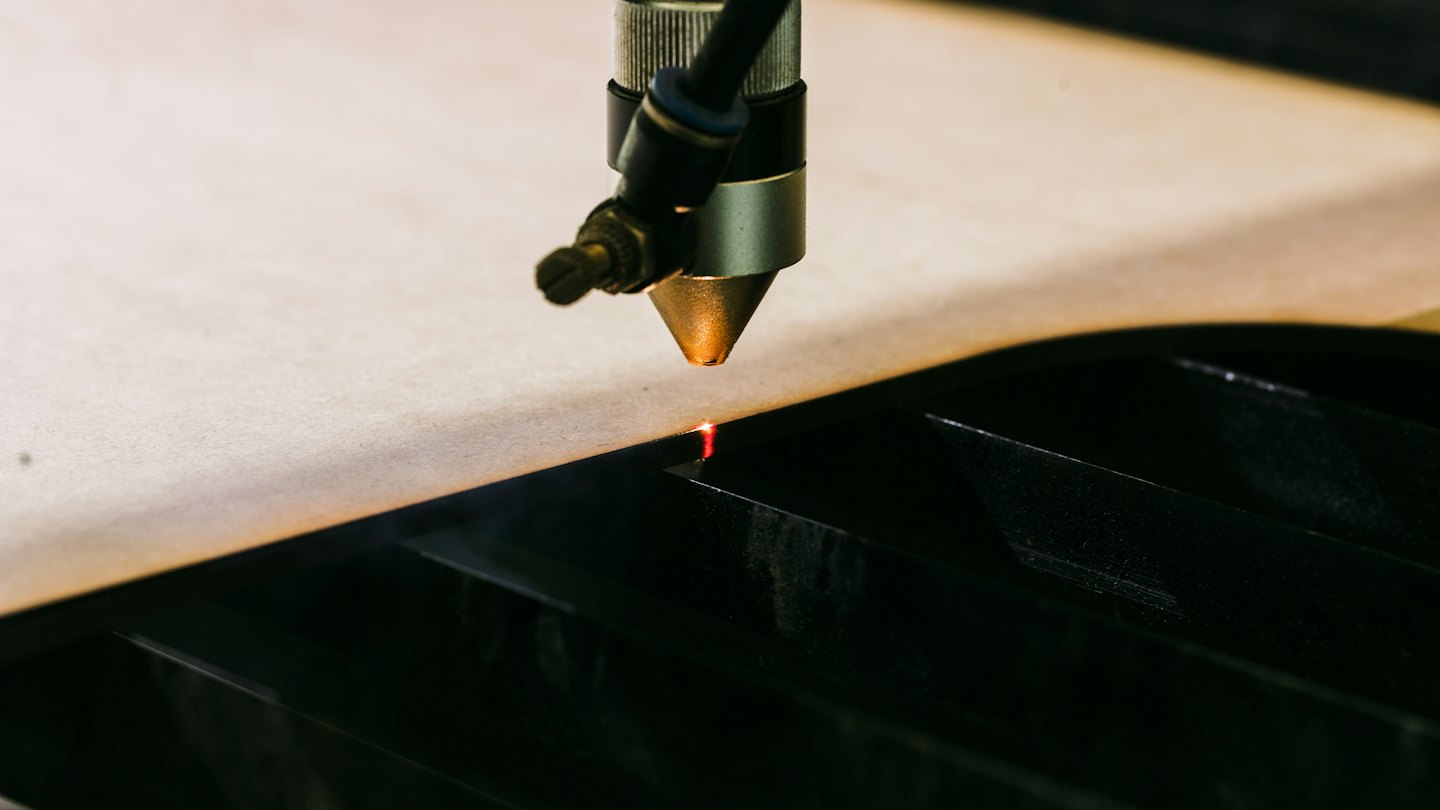 Laser cutting machine precisely cuts into sheet material.